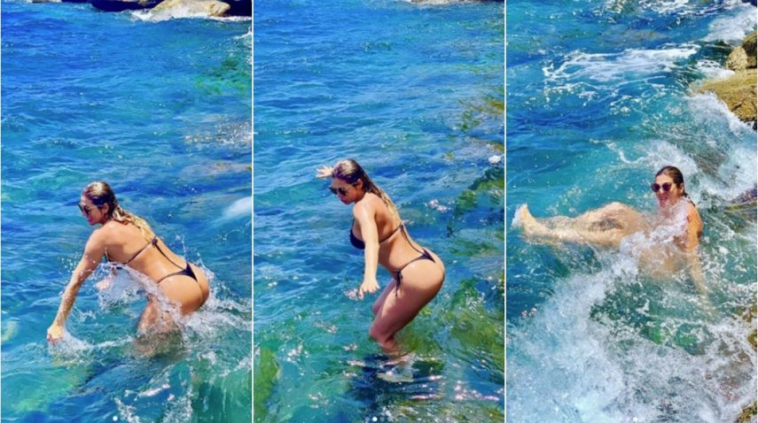 Lívia Andrade tenta sensualizar e leva tombo no mar